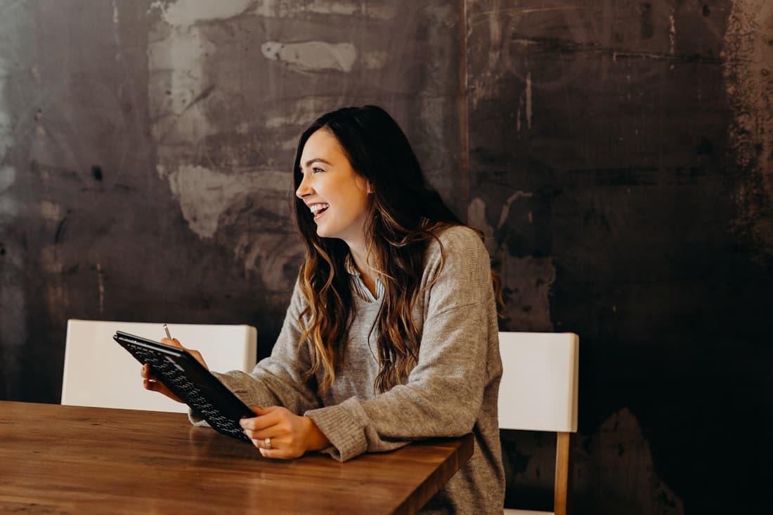 An owner reviewing her cash flow on a tablet.
